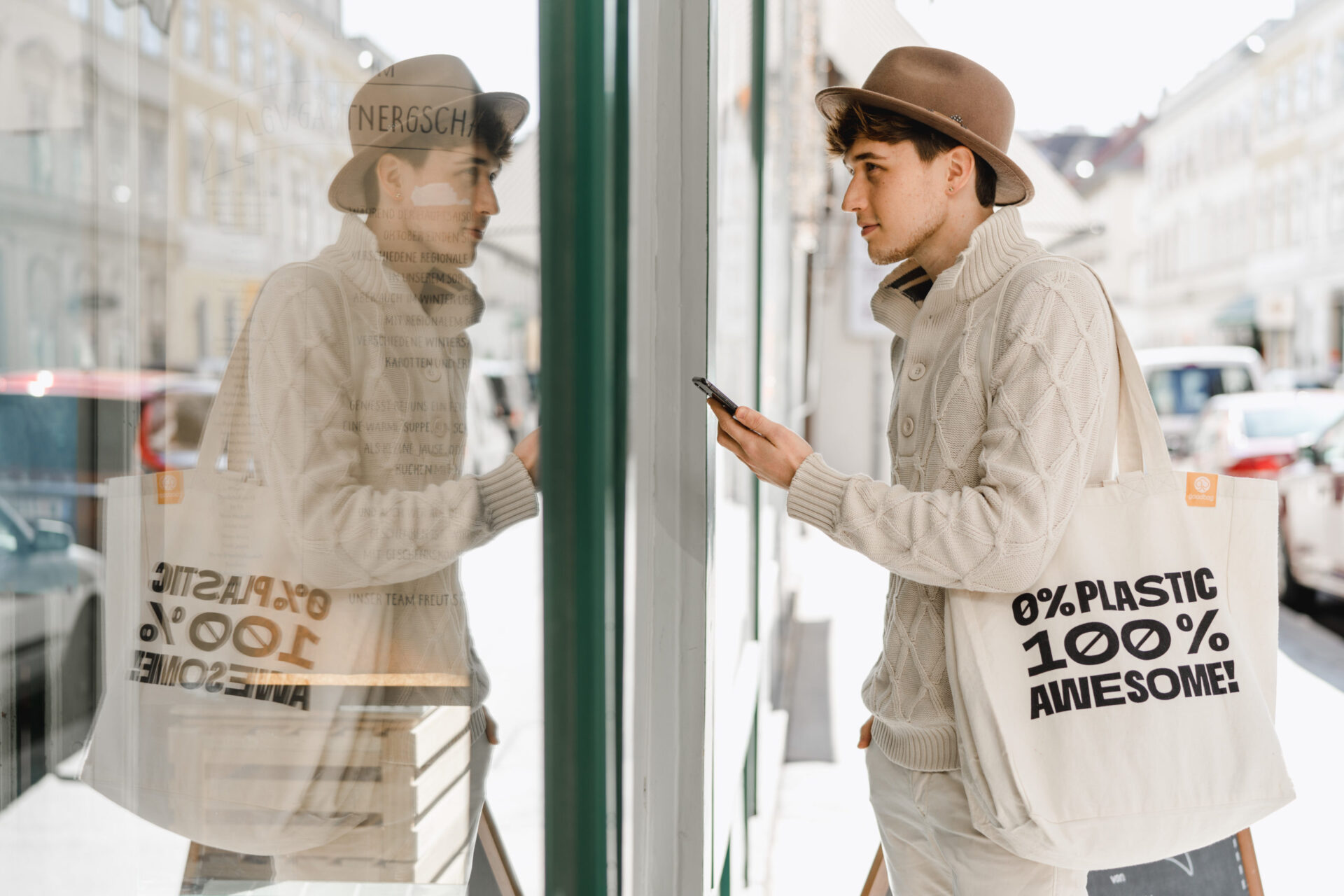 man enters shop with bag